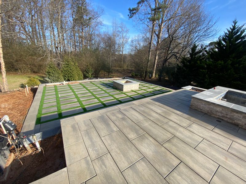 "Transforming Sugarloaf: A Masterpiece of Pavers, Turf, and Fire Features by JAD LANDSCAPE LLC"
