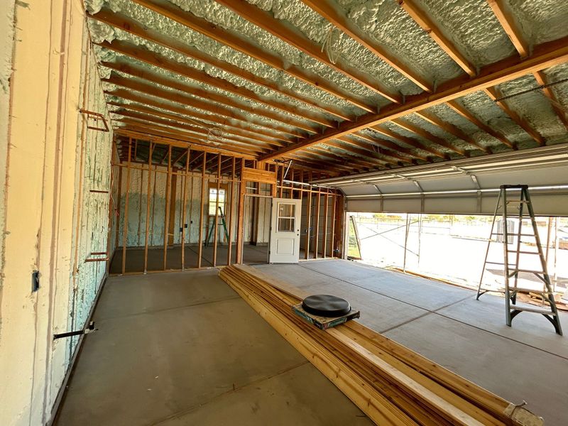 Shop roof deck sprayed with open-cell foam