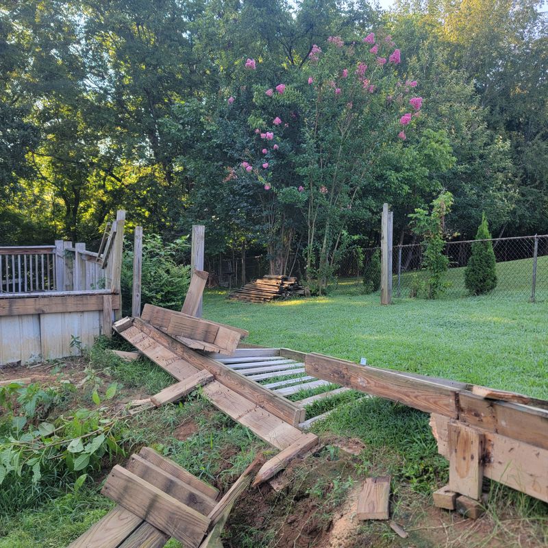 Old wooden deck partly taken apart during a small demolition