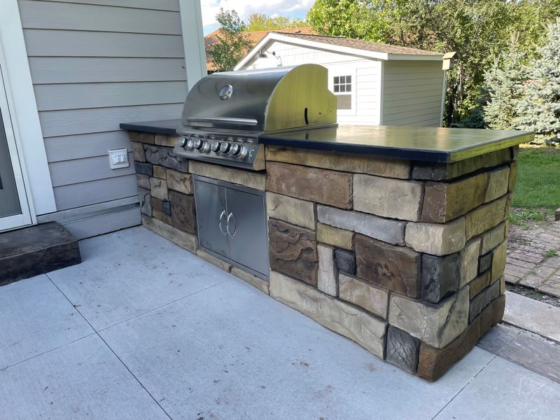 Outdoor kitchen and living spaces.