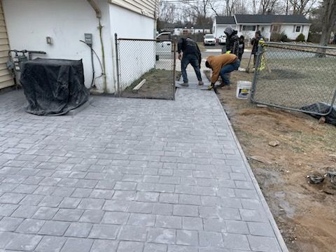 Masonry Masterpiece in Howell, NJ: Transforming Outdoor Living with Thermal Bluestone and Stamped Concrete