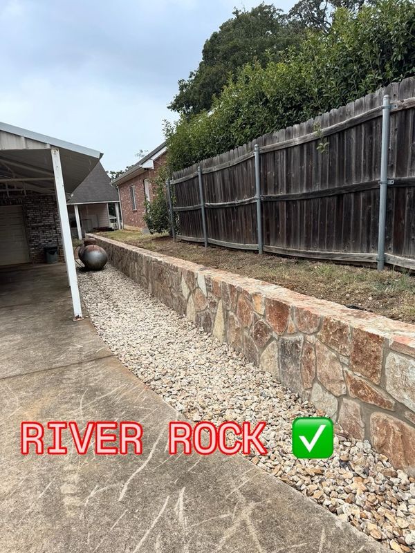 New Natural Stone Retaining Wall Installation to Replace the Old Wooden wall