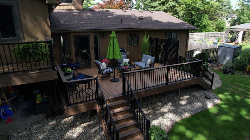 Wolverine Lake's Illuminated Deck Oasis: A Sunstone Construction Showcase in Landscaping Mastery