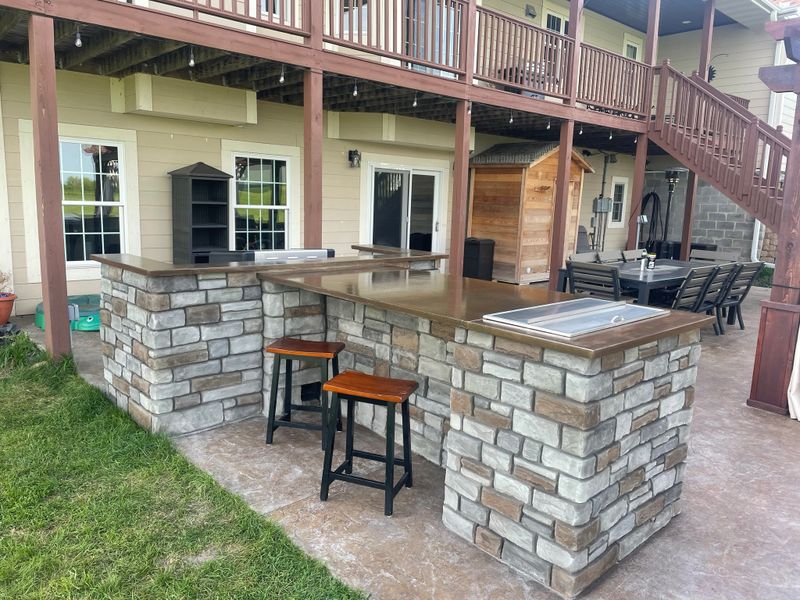 Outdoor kitchen and living spaces.