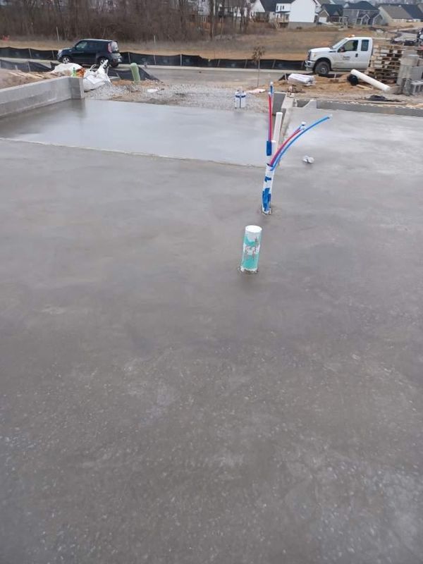 House slab with plumbing stubs ready for a pour