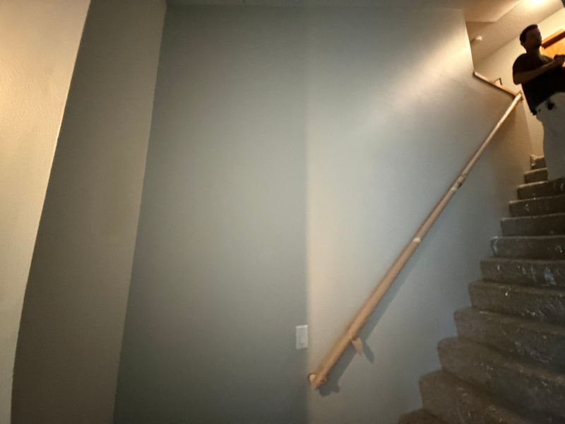 Staircase Transformation: Elegant Wall Renovation with Swift, Professional Execution by Kiloco LLC