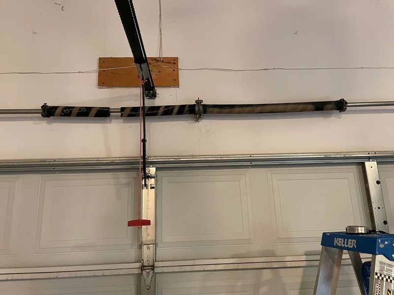 Effortless Garage Door Revitalization: Seamless Spring Replacement and Comprehensive Maintenance by JR Garage Door and Services
