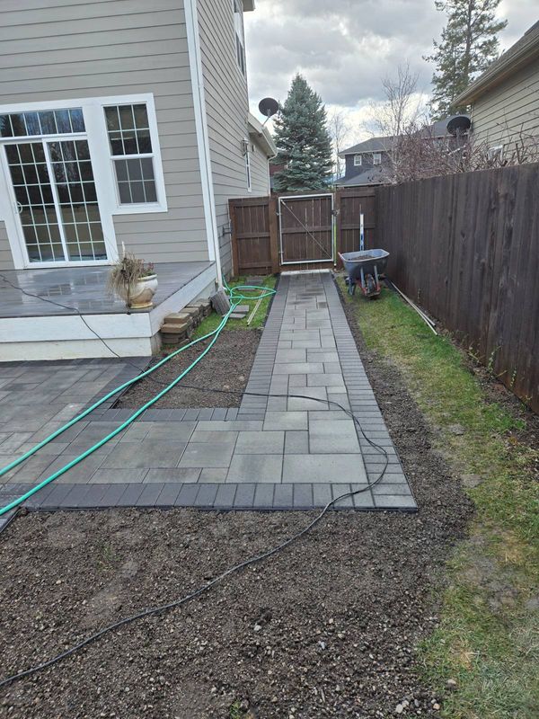 "Enchanting Outdoor Oasis: Transforming Coeur d'Alene with Expert Patio Installation by Ida-Home Hardscapes"