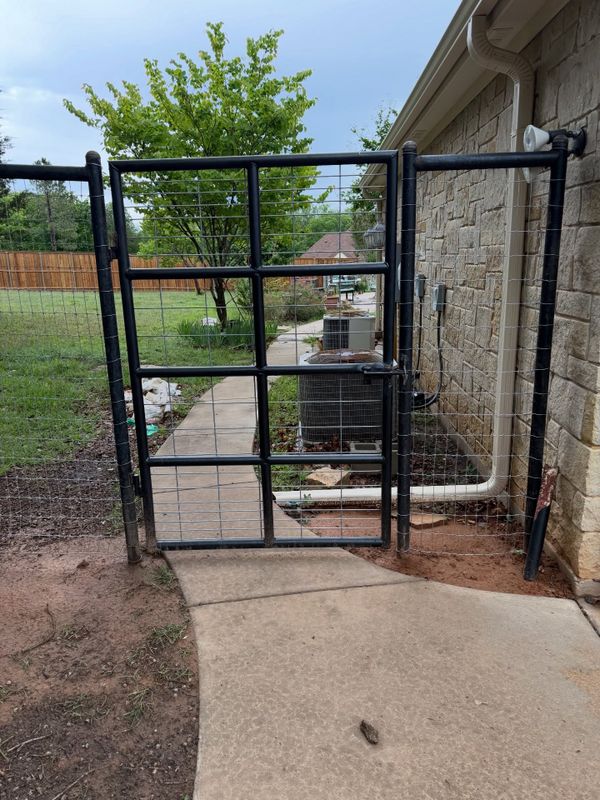 Close view of a welded pipe entry gate built by Bighorn Bros Construction