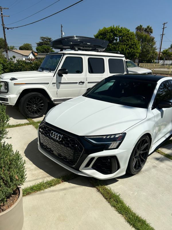 White Audi sedan and Mercedes G-Wagon after detail