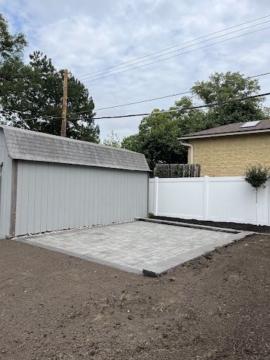 Backyard Transformation with Elegant Patio Installation by Kuta Lawn And Landscape LLC