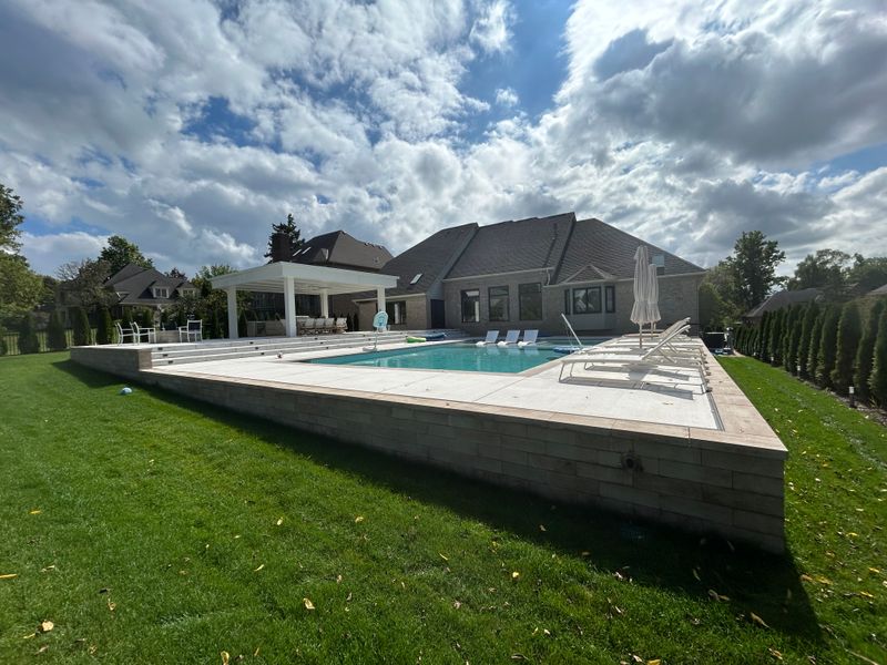 Backyard Paradise Unveiled: Luxury Poolside Landscaping in Farmington Hills