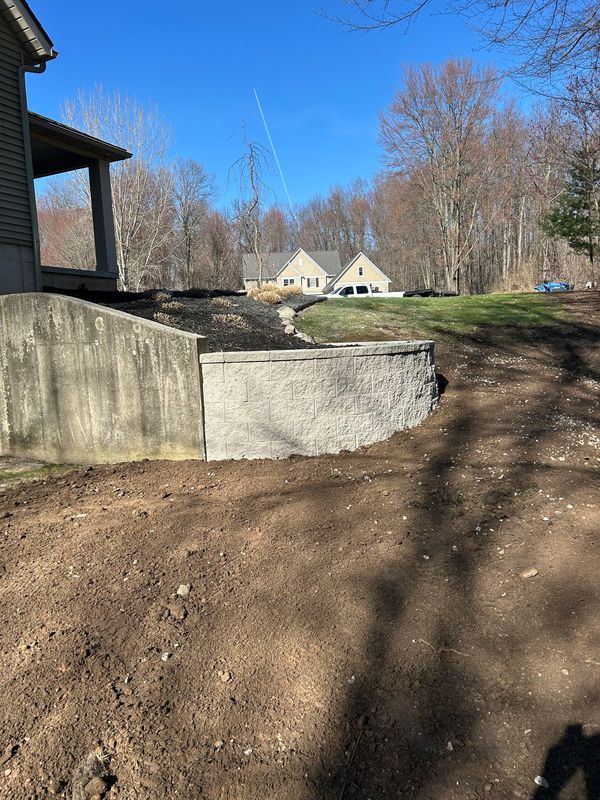Fresh Block Retaining Wall Built to Hold the Hill