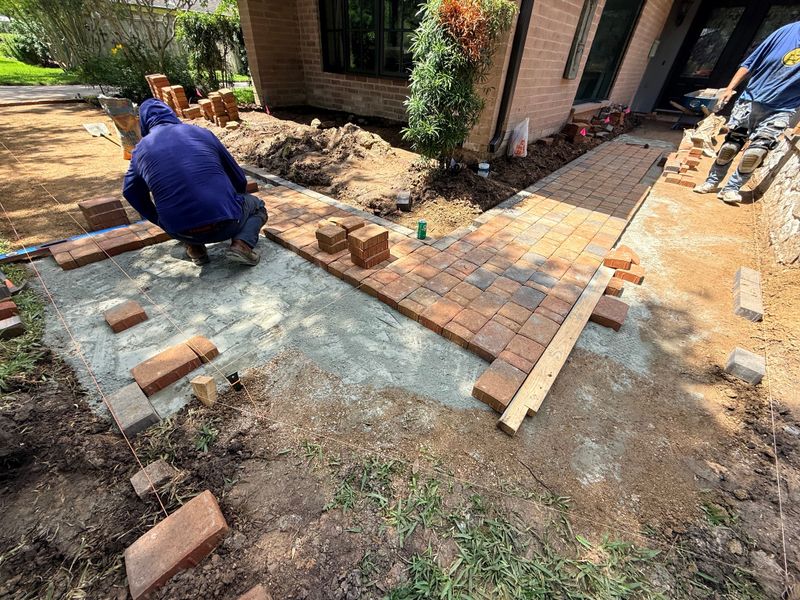 Paver walkways look simple until you start worrying about slope and drainage. If the base isn't graded right, water pools or the whole thing settles unevenly over time. We dial in the foundation before the first paver goes down 👊