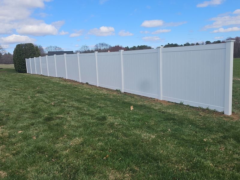 "Elegant Privacy Redefined: Fencescapes LLC's Durable Vinyl Panorama"
