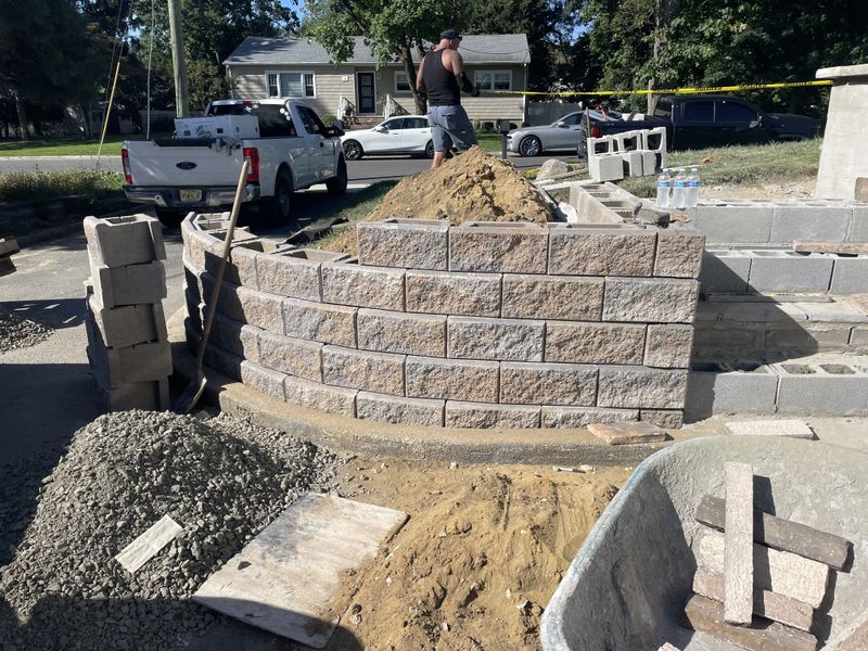 Transforming Spaces: Expert Retaining Wall Installation by McClelland Masonry (In-progress)