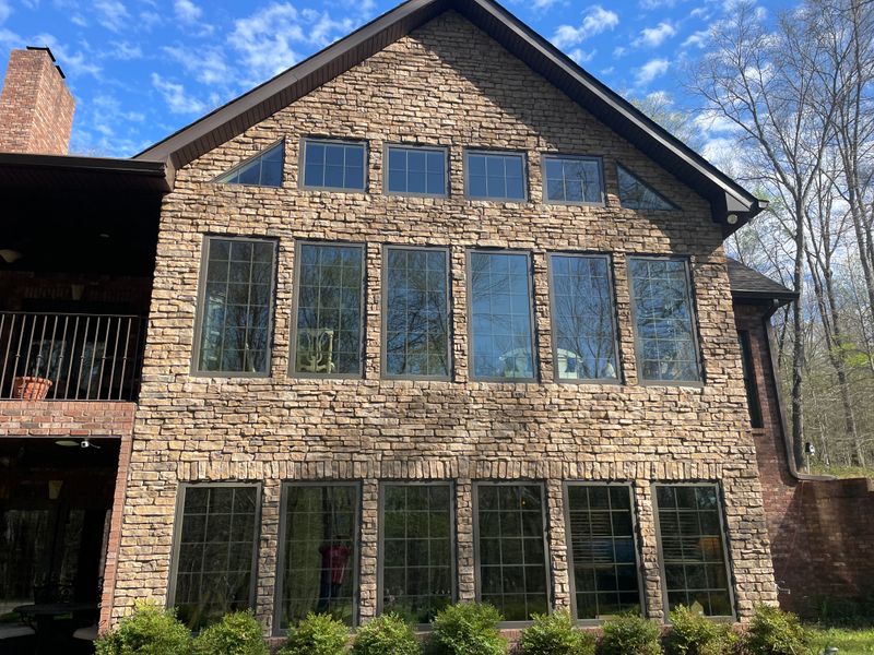 Revitalizing Elegance: Soft Washing on Yarbrough Lane's Stone Home by Oakland Power Washing