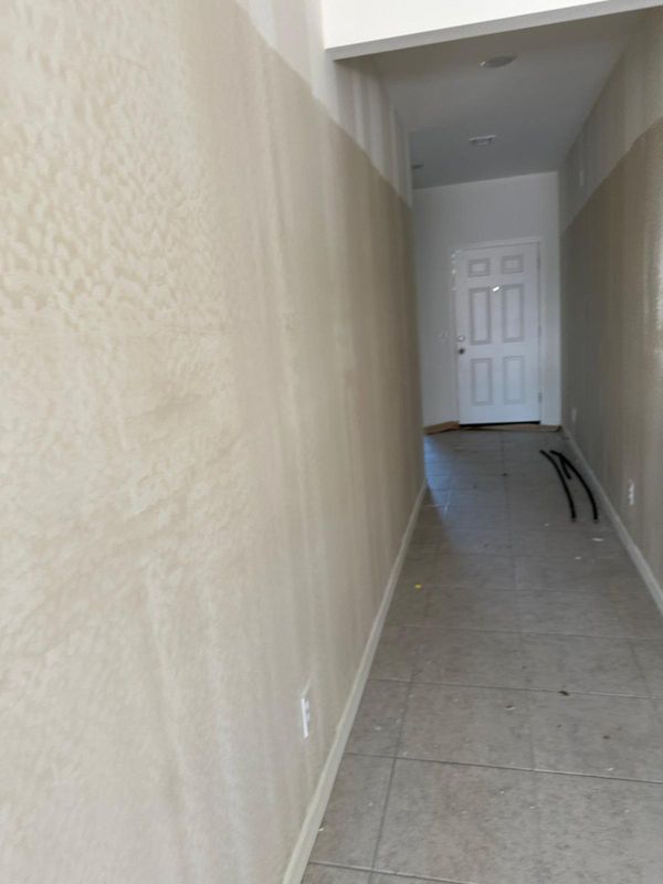 Seamless Precision: Transformative Hallway Drywall Installation by MC Drywall Solutions