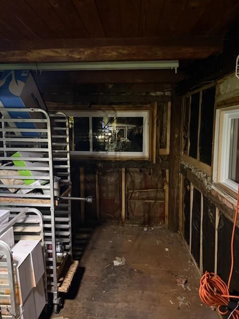Room stripped back to the wall studs during demolition