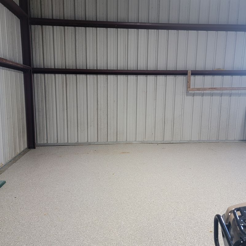 The same warehouse bay empty and clean after the cleanout
