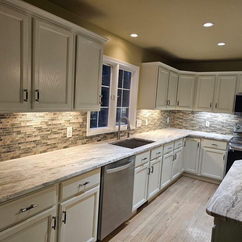 Transformative Kitchen Remodel in Livonia, MI: Exquisite Cabinet Refinishing & Stylish Backsplash Installation