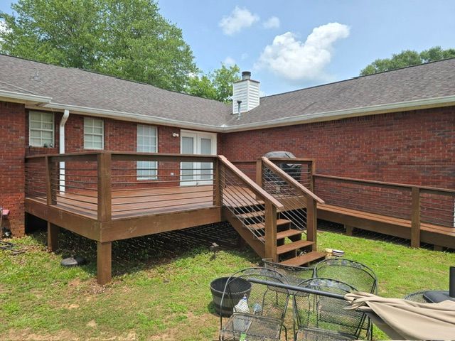 Transforming Spaces: Elevate Your Backyard with Our Modern Deck and Ramp Design