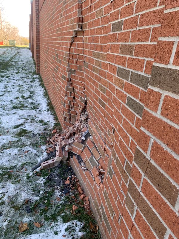 Vehicle Impact Brick Wall Damage Secured Fast in Omaha