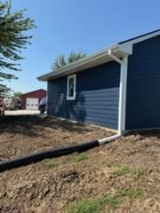 Stunning Exterior Transformation with Matlage Wall Finishes: Bold Blue Refresh