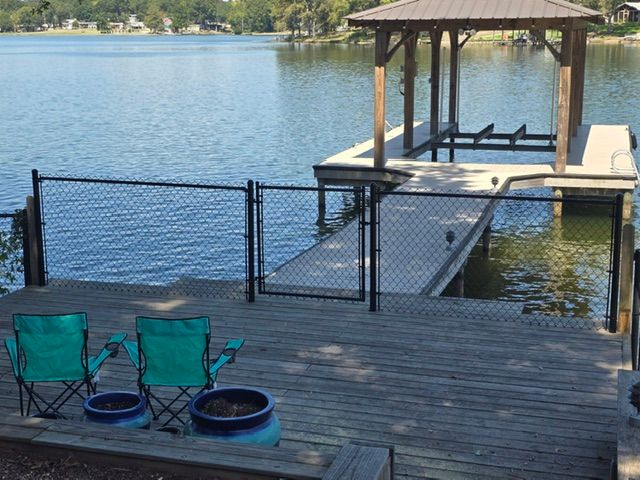 Lakeside Serenity: Enhancing Outdoor Spaces with Secure Fencing and Decking by Coosa Valley