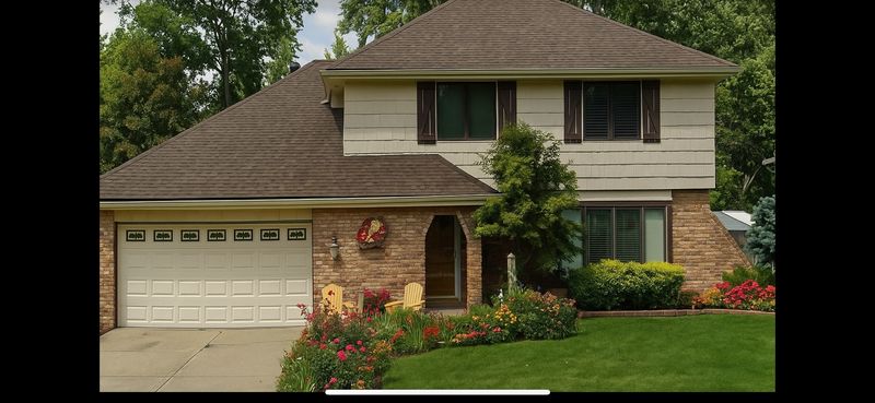 Roof & Gutter Transformation by Genesis Roofing & Construction