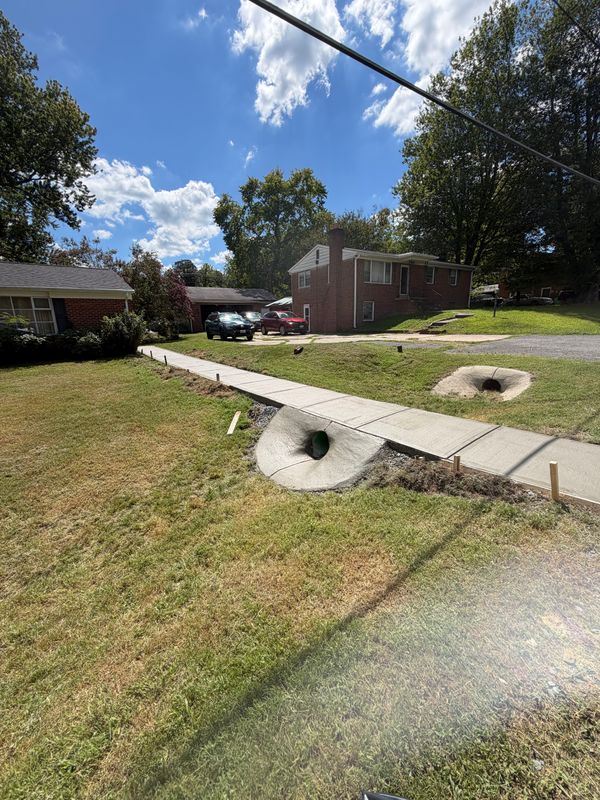 Concrete Sidewalk with Culvert Pipe installation