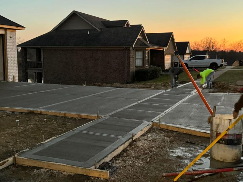 Concrete walkways around a home at sunset