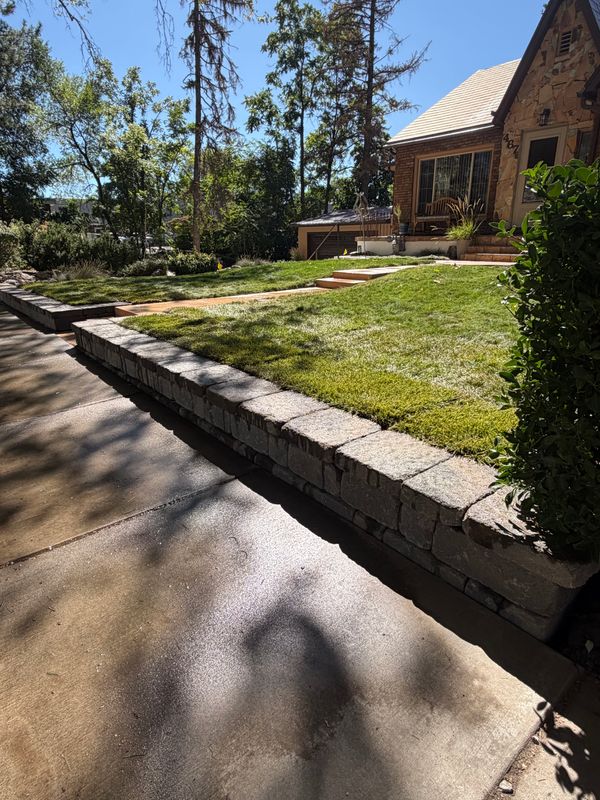 Block Wall and Sod Turn a Sloped Front Yard Into Usable Space