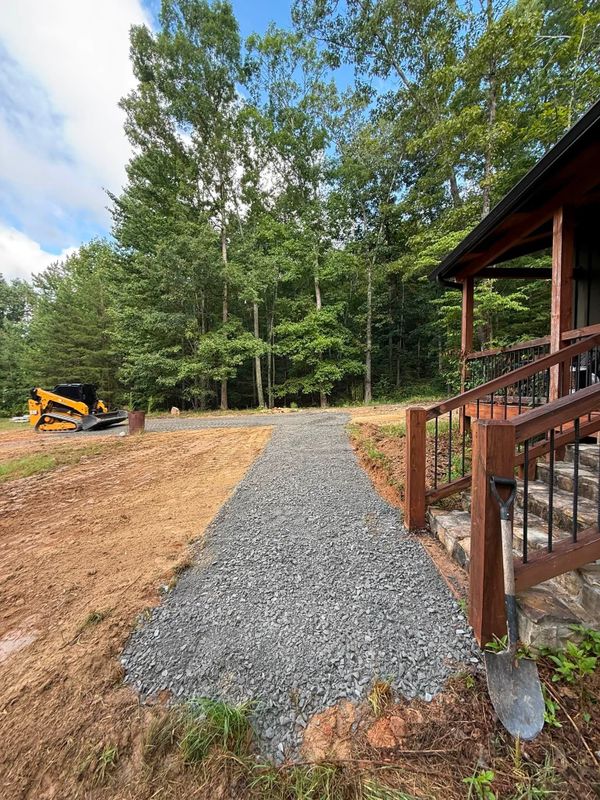 Enhancing Curb Appeal: Sidewalk Installation & Gravel Driveway Refresh
