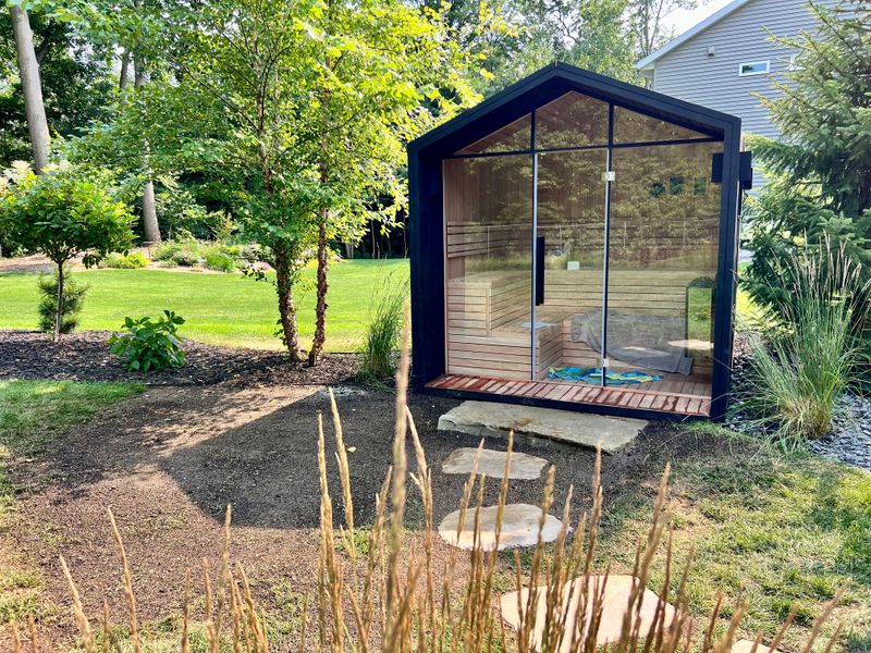 Tranquil Retreat: Innovative Backyard Oasis by Greenscape Lawns