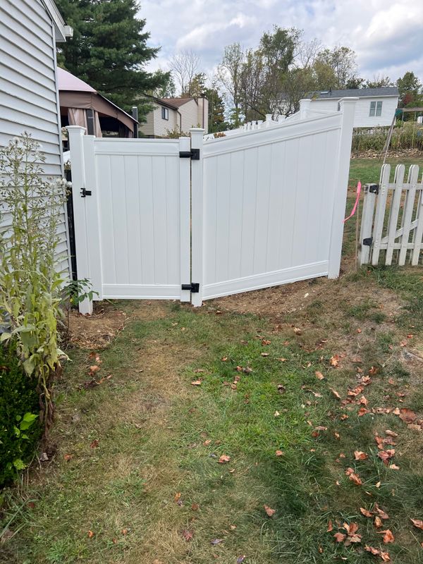 Transforming Yards with Precision: A Stunning White Fence Installation