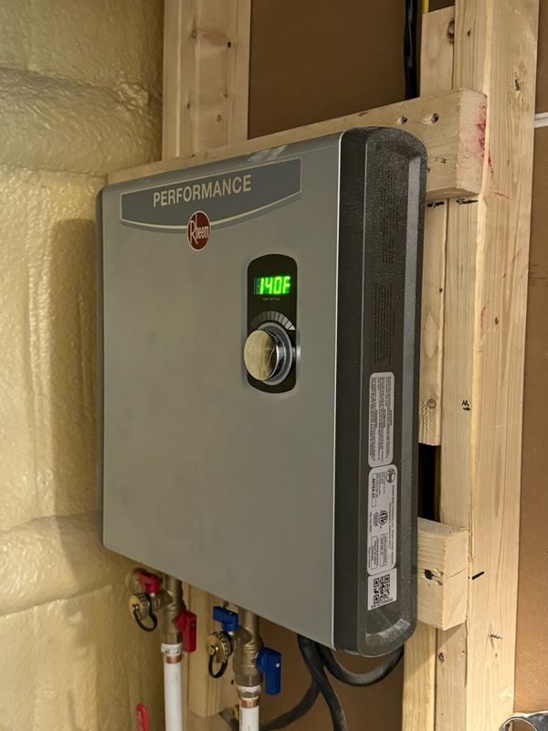 The Future of Heating: Dutton Plumbing's Seamless Electric Tankless Water Heater Installation