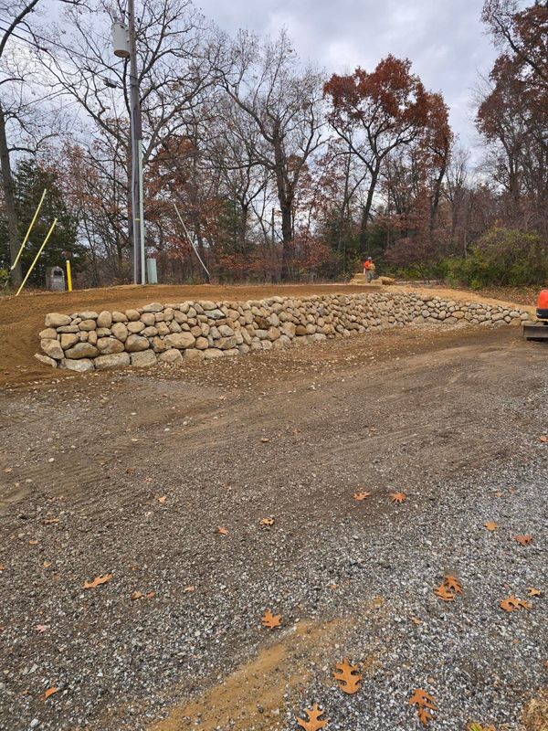 Hillside Harmony: A Stunning Retaining Wall Transformation by Michiana Boulders in Union, MI