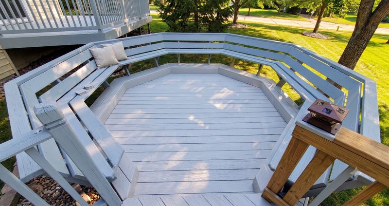 Octagon deck with built-in bench seating after a fresh finish