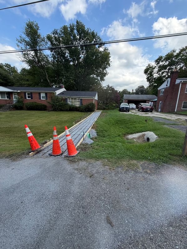 Concrete Sidewalk with Culvert Pipe installation