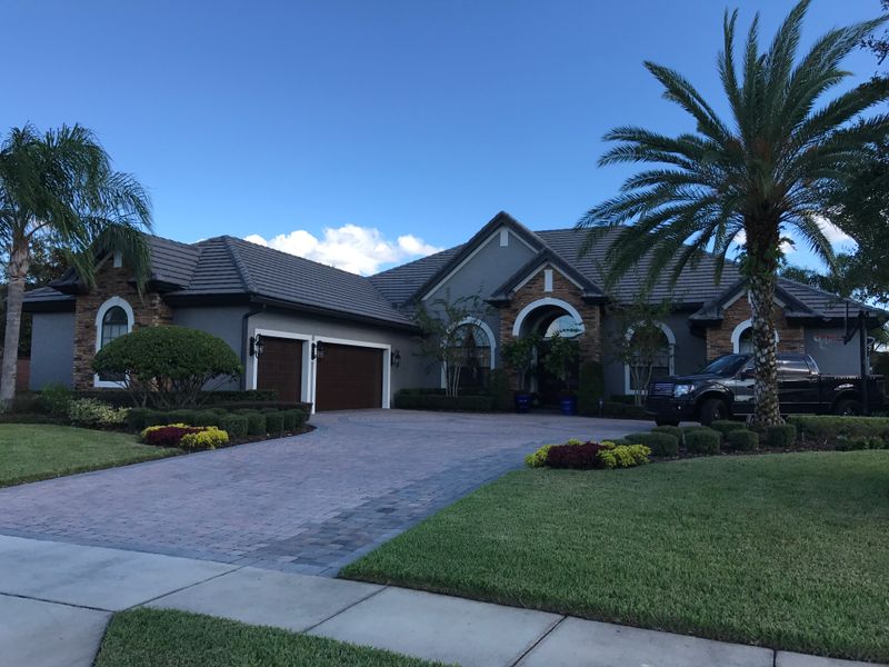 Stunning Transformation: Exterior Painting of a Beautiful Windermere Home by Paint Bros of Orlando