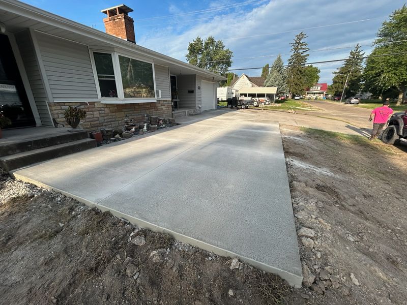 Expert Concrete Craftsmanship: Transforming Front Patios with Durability and Style