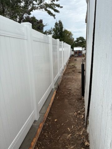 "Enhancing Clearfield Elegance: Premium White Vinyl Fence Installation by BMG Fencing"