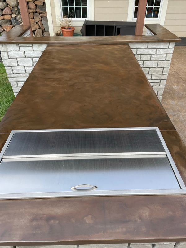 Outdoor kitchen and living spaces.