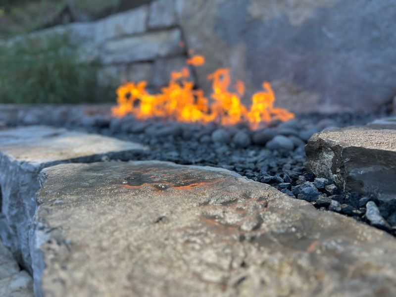 Revitalize Your Outdoor Space with a Stunning Stone Fire Feature