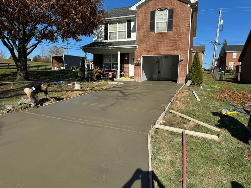 Concrete driveway being poured at a townhouse