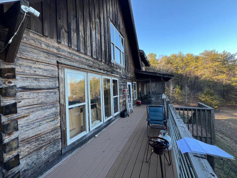 "Elevating Elegance in Jemison: Rojas Renovations' Masterful Balcony Roof and Chimney Siding Transformation"