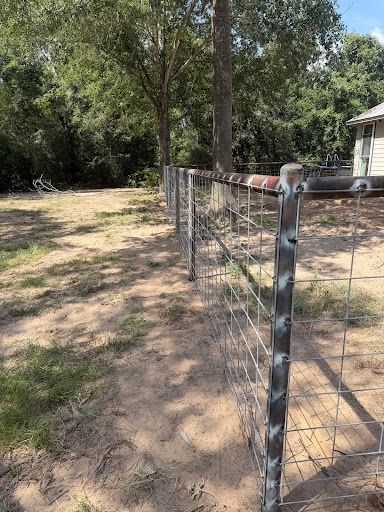 Custom Pipe fencing, entrances and riding arena