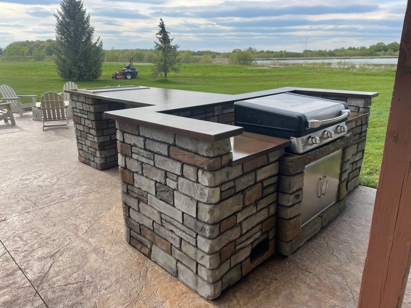 Outdoor kitchen and living spaces.