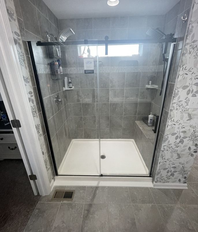 Crystal Clear Transformation: Seamless Glass Door Installation by Dutton Plumbing, Inc.